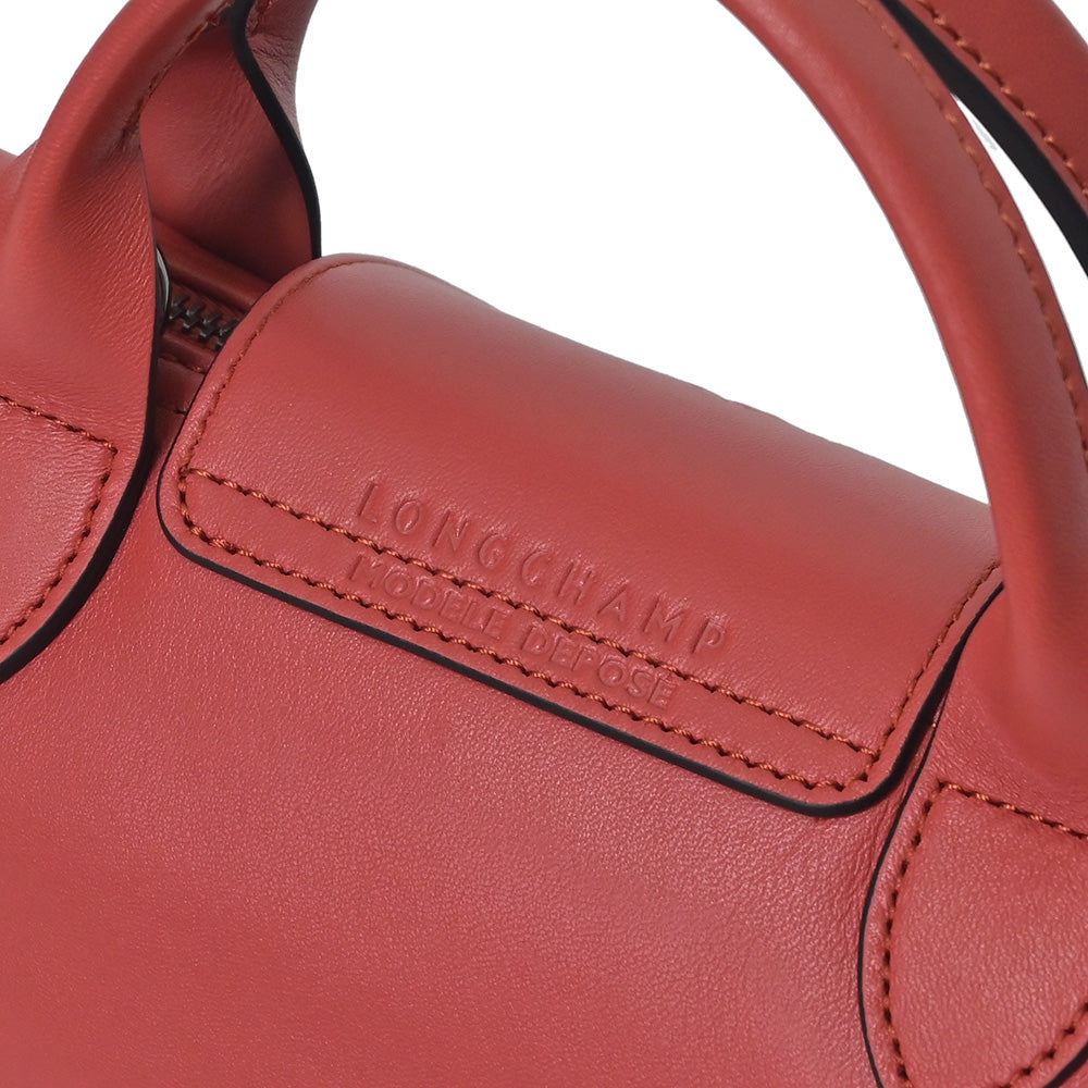 Shop Longchamp Le Pliage Cuir XS Top Handle Bag
